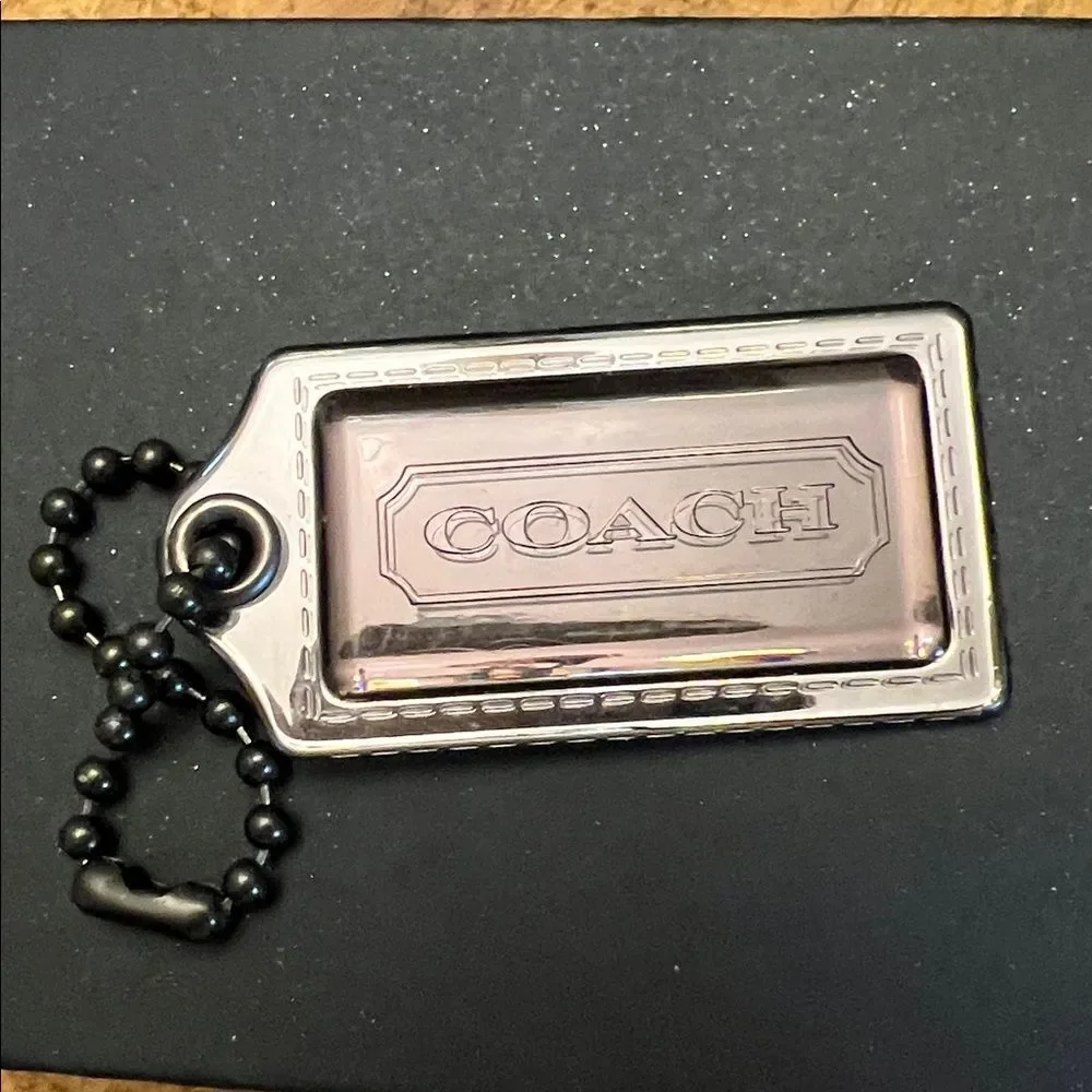 Coach Poppy plastic hangtag smoky gray with chunky ballchain